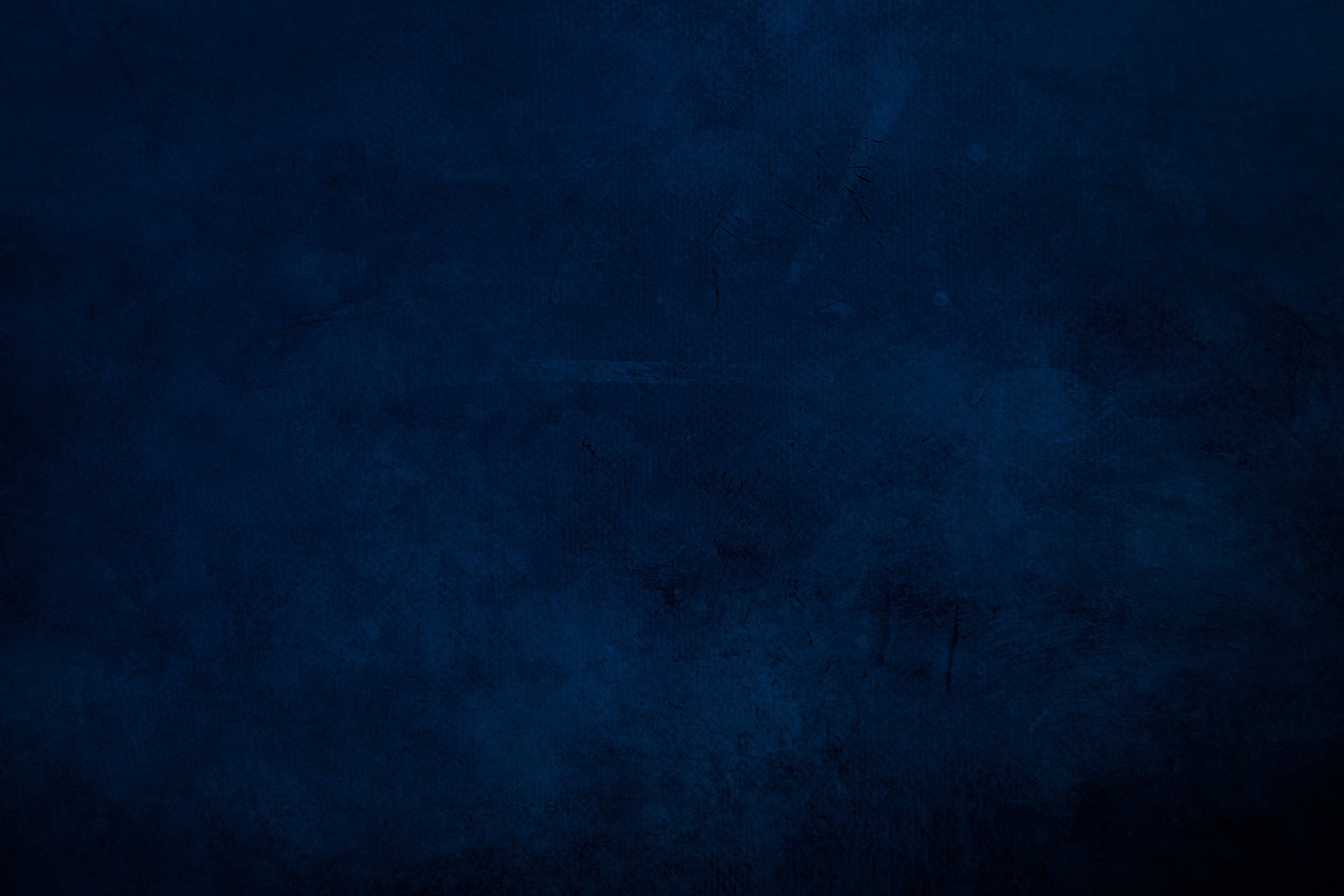 DArk blue grungy canvas background or texture with dark vignette borders